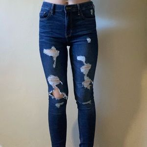 Long high waisted distressed skinny jeans